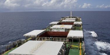 bulk_cargo_ship_underway_with_opened_hatch_covers-shutterstock_134548574-lukaszz